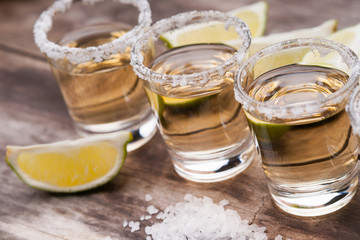 Tequila shots with lime fruits and salt 