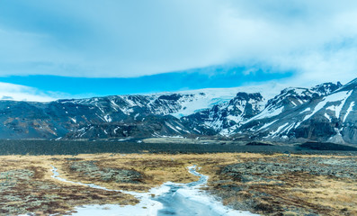 Fototapeta na wymiar Mountains near entrance of ice cave in Iceland