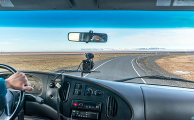 Car dashboard on road in Iceland