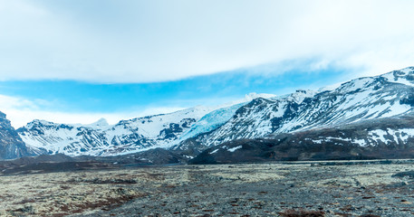 Mountains near entrance of ice cave in Iceland