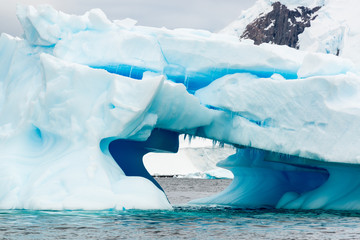Iceberg and mountains along the Antarctic Peninsula