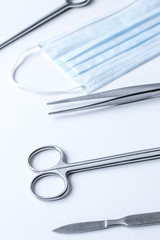 instruments for plastic surgery on white background