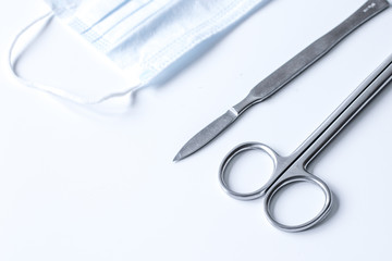 instruments for plastic surgery on white background