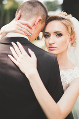 Sensual portrait of a young wedding couple. Outdoor