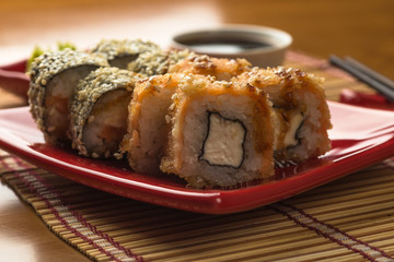 Sushi roll set in tempura and sticks