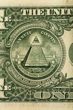 Conspiracy theory concept. All Seeing Eye and Pyramid on USA dollar banknote