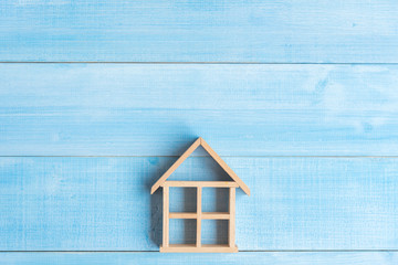 top view of wood house on light blue wood plank floor