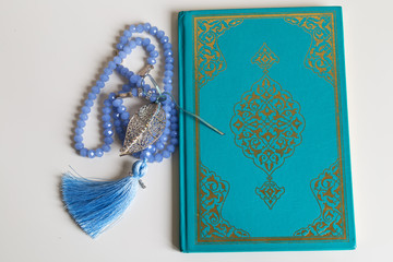 Holy book for Muslims. Quran and rosary concept. Ramadan concept. Three months. 