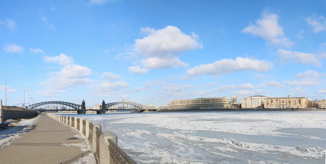 panorama of a snow-covered frozen river