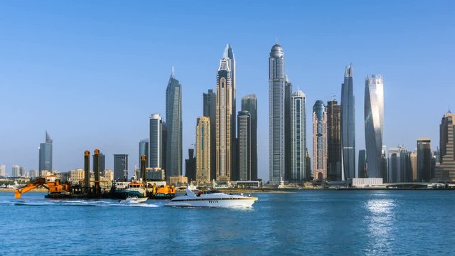 Beautiful view of Dubai Marina skyscrapers, sunset time, View from Palm Jumeirah, timelapse, Dubai, United Arab Emirates.