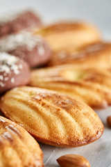 Tasty almond cookies arranged in the shape of fan on white background, close-up, selective focus