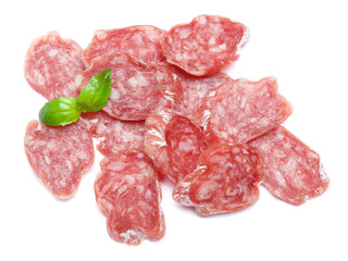 Dried sliced organic salami sausage on white background