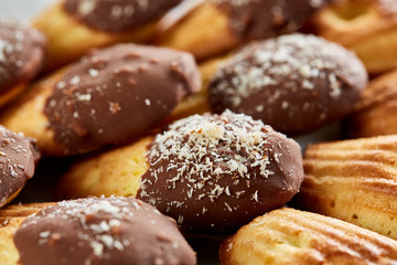 Tasty almond cookies arranged in the shape of fan on white background, close-up, selective focus