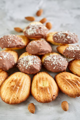 Tasty almond cookies arranged in the shape of fan on white background, close-up, selective focus