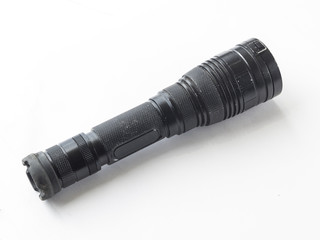tactical flashlight on white background