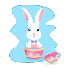 Funny bunny sitting in an Easter egg.