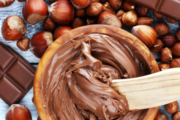 Homemade hazelnut chocolate spread in wooden bowl. Hazelnut Nougat cream