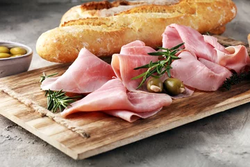 Küchenrückwand glas motiv Sliced ham on wooden board. Fresh prosciutto. Pork ham sliced. © beats_