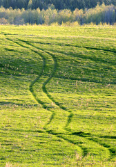 Ride the tractor on a hilly field..