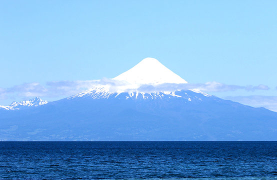 Lago (Lake) Llanquihue at Puerto Varas.  Snowcapped Osorno Volcano in the background. Chile, South America
