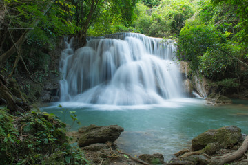 Fototapeta na wymiar Huay Mae Khamin waterfalls in deep forest at Srinakarin National Park ,Kanchanaburi ,A beautiful stream water famous rainforest waterfall in Thailand