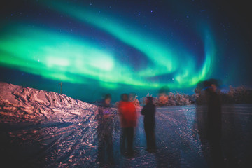 Beautiful picture of massive multicolored green vibrant Aurora Borealis, also known as Northern...