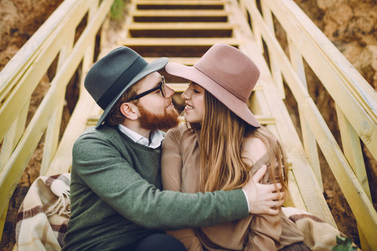 Cute Couple Hugging At The Stairs. Close-up portrait