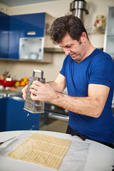 Man preparing cheese crackers