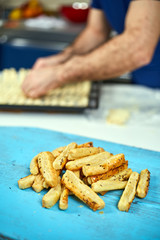 Man preparing cheese crackers