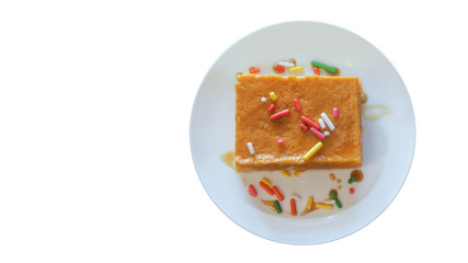 Top view of Delicious Custard Chiffon Cake with Syrup or Honey and Colorful Chocolate Dressing.  This Custard Cake Is A Good Pair with Any Beverage Such As Coffee or Tea.
