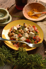 tofu salad, chickpeas, peas and tomato - vegetarian food