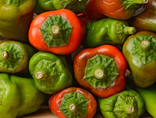 peppers of various colors on the table