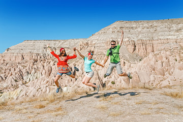 Three young friends jumping and having fun in Cappadocia, Turkey