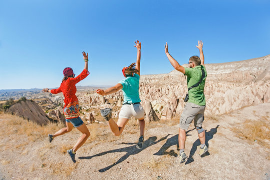 Three young friends jumping and having fun in Cappadocia, Turkey
