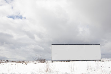 vacant field with blank sign