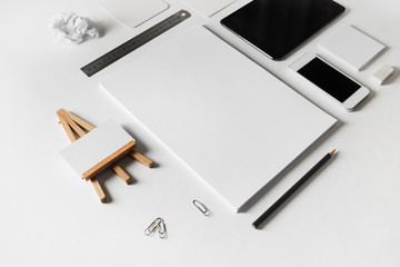 Corporate identity template on white paper background. Photo of blank stationery set. Mockup for design presentations and portfolios. Selective focus.