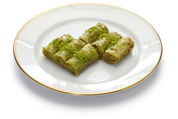 pistachio rolls baklava, fistikli sarma, turkish traditional dessert isolated on white background