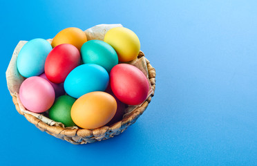 Colorful easter eggs composition on blue background