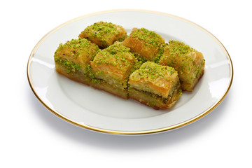 pistachio baklava, fistikli baklava, turkish traditional dessert isolated on white background