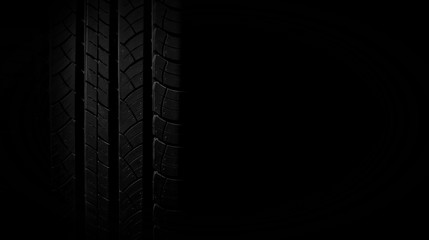 Naklejka premium new tire texture in the dark for background