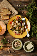 tofu salad, chickpeas, peas and tomato - vegetarian food