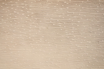 Close up of paint covering stucco wall