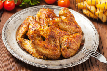 Baked wings, served with dip or baked potatoes.