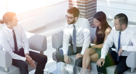 employees sitting in the lobby of the office.