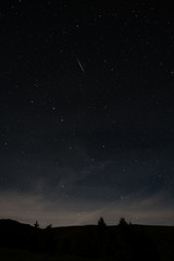 Shooting star of the annual star shower Perseids, taken in Austria in high format