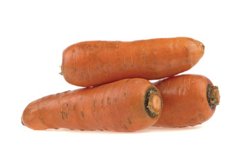 three carrots close-up isolated on white background