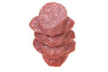 sausage sliced in thin slices isolated on white background