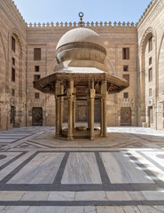 Ablution fountain mediating the courtyard of Al-Sultan Al-Zahir Barquq Mosque, Al Moez Street,...