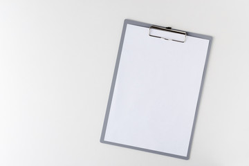 clipboard with a blank sheet of paper