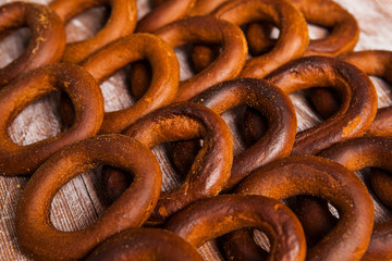 Tasty bagels. Fresh bagels on rustic wooden background.